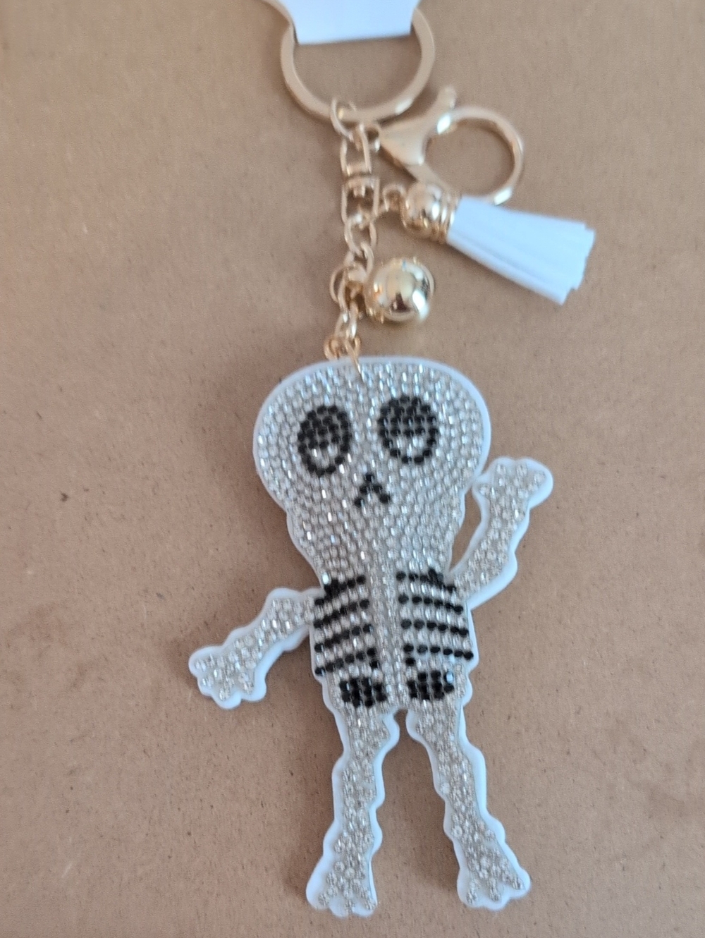 White Crystal Skeleton Keychain Charm with Gold Hardware